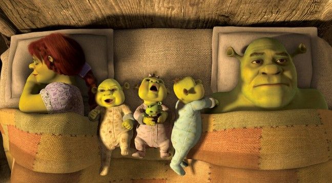 Image of Shrek and Fiona in bed with their three babies.