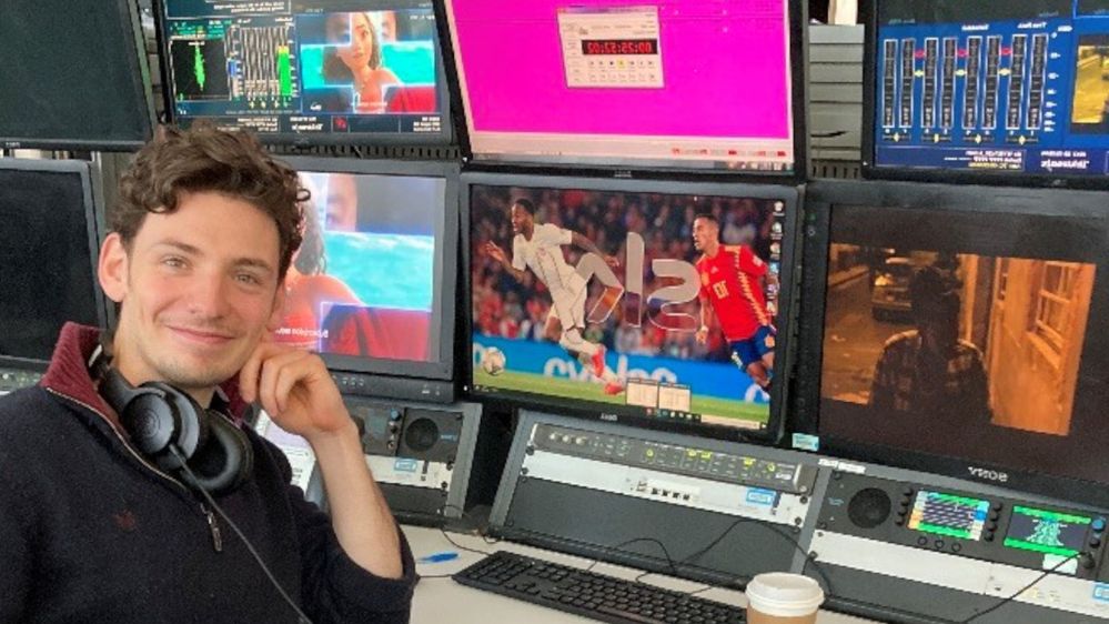 Sky QA Operator James sitting in the master control room.jpg